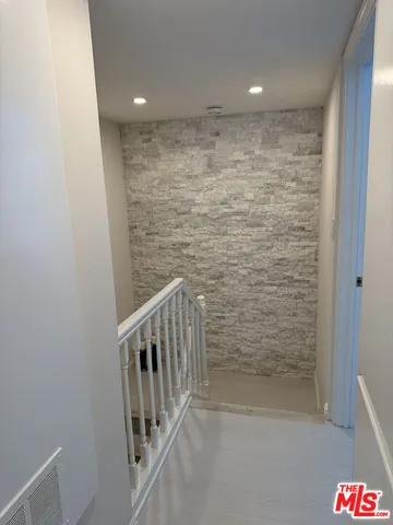 a view of hallway with stairs