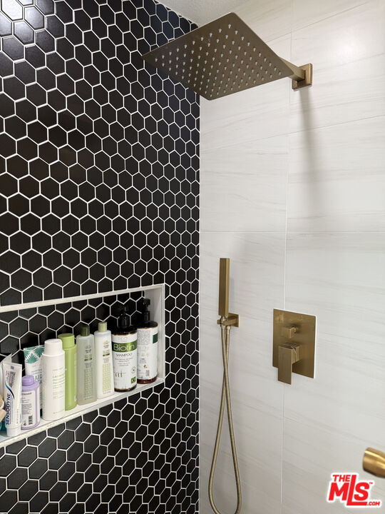 13218 Fiji Way, Unit J Marina del Rey, CA 90292 - Photo 32 of 33 a bathroom with a shower and a sink