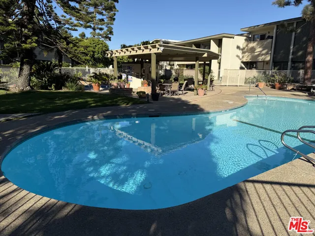 a view of a swimming pool with a patio