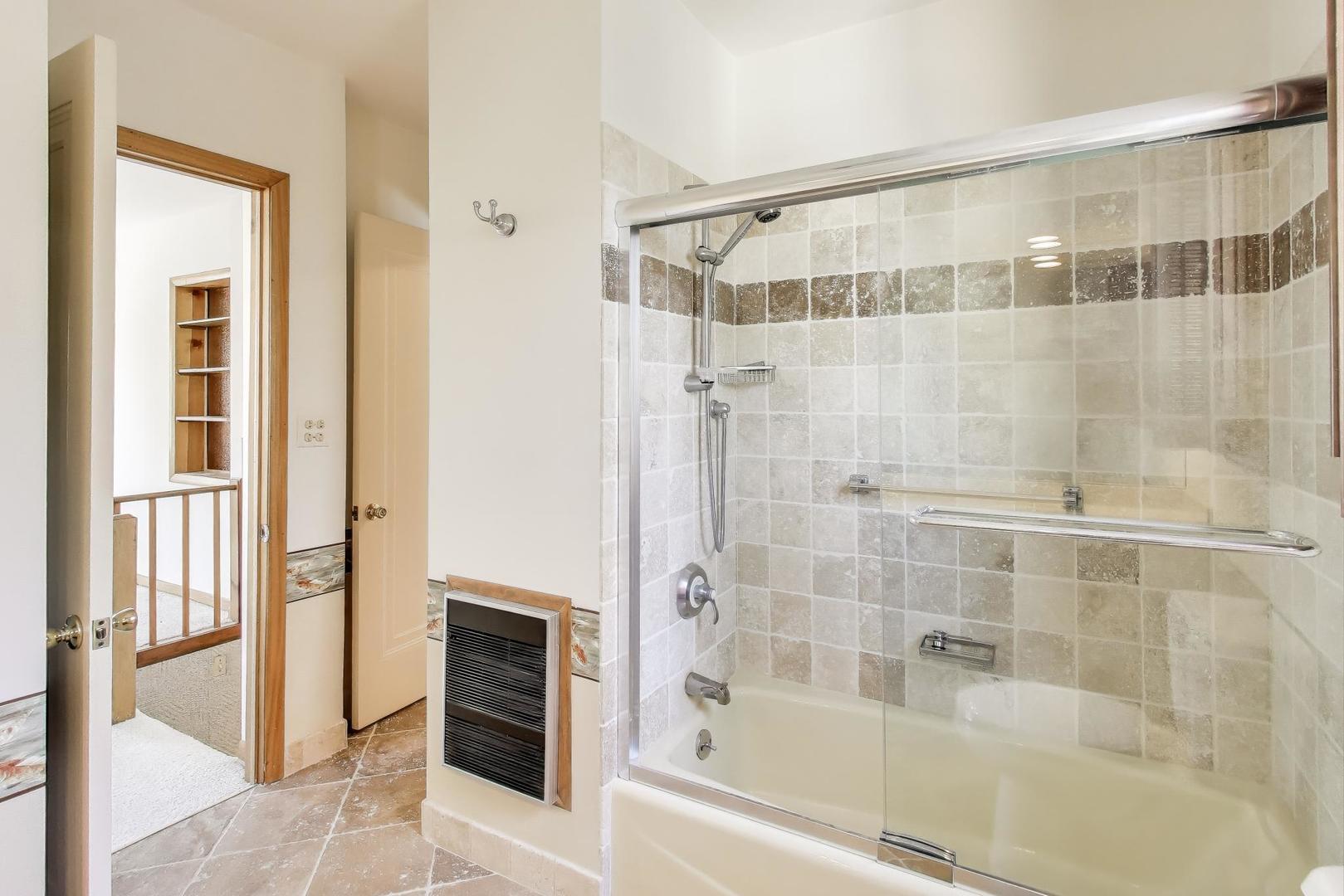 1227 16th Street Wilmette, IL 60091 - Photo 15 of 22 a bathroom with a bathtub and a shower