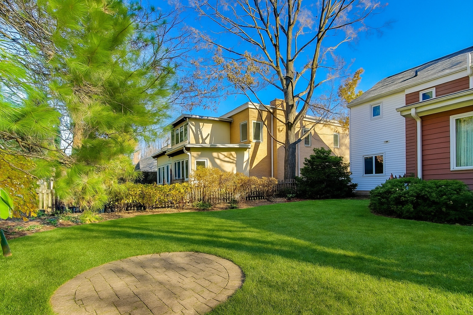 1227 16th Street Wilmette, IL 60091 - Photo 18 of 22 a view of a white house with a big yard and large trees