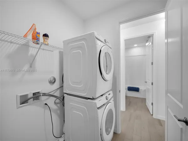 a view of a storage & utility room with a sink