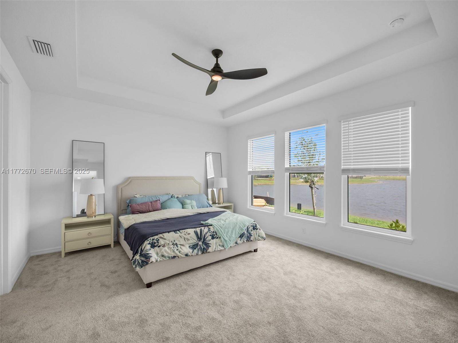 516 Ranch Oak Circle Port St. Lucie, FL 34984 - Photo 13 of 44 a bedroom with a bed couch and window