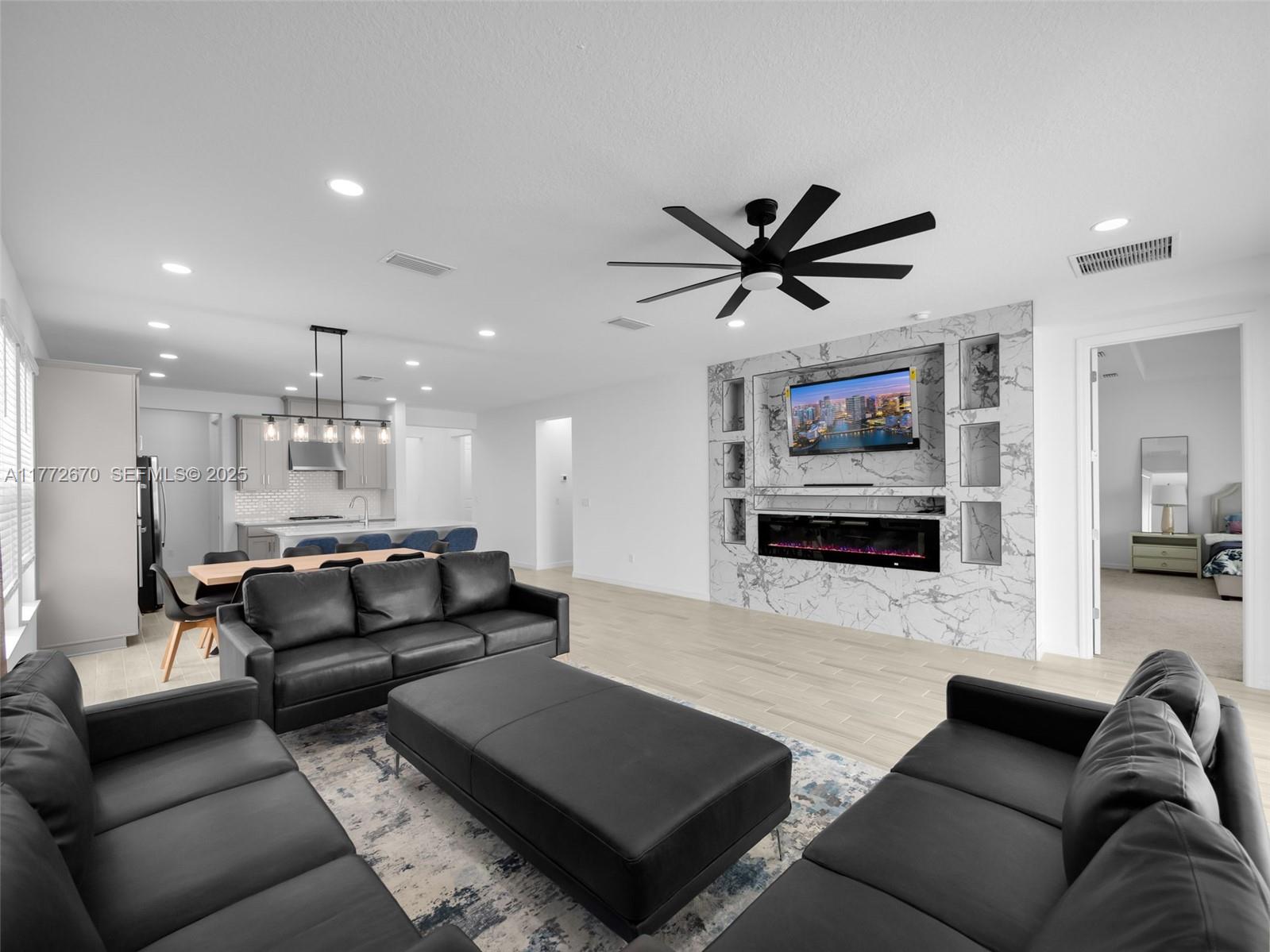 516 Ranch Oak Circle Port St. Lucie, FL 34984 - Photo 14 of 44 a living room with furniture and a flat screen tv