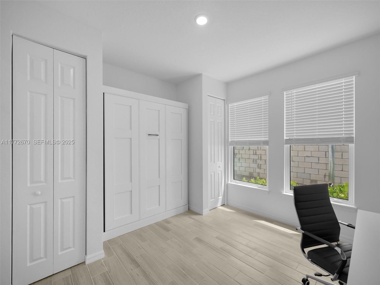 516 Ranch Oak Circle Port St. Lucie, FL 34984 - Photo 19 of 44 a view of a livingroom with workspace and a window