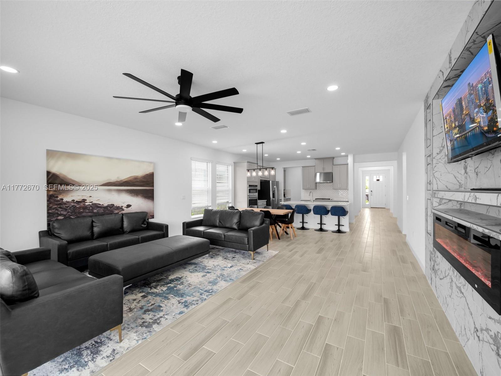 516 Ranch Oak Circle Port St. Lucie, FL 34984 - Photo 20 of 44 a living room with furniture and a flat screen tv