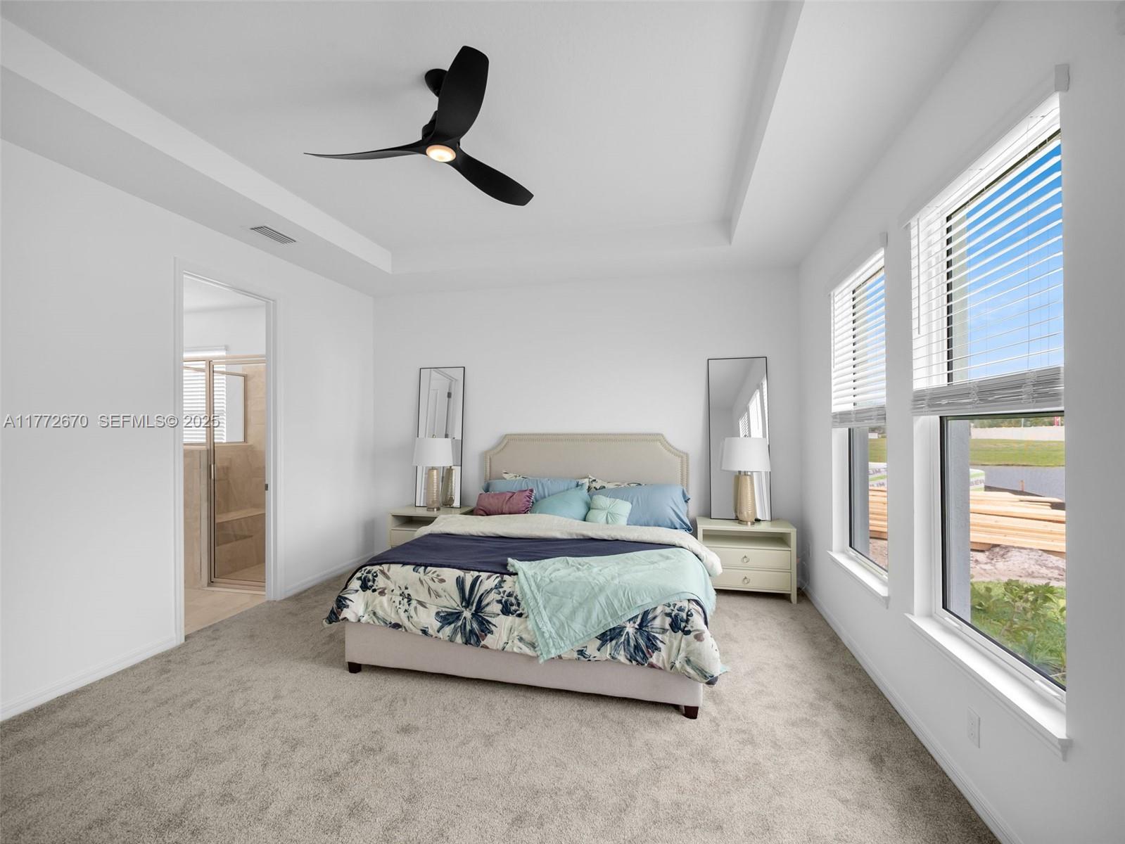 516 Ranch Oak Circle Port St. Lucie, FL 34984 - Photo 24 of 44 a bedroom with a bed and a large window