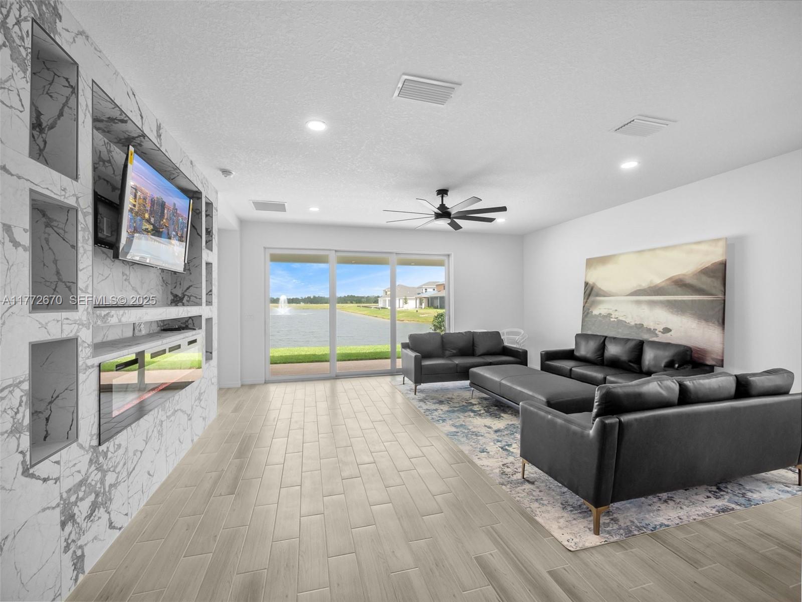 516 Ranch Oak Circle Port St. Lucie, FL 34984 - Photo 25 of 44 a living room with furniture and a large window