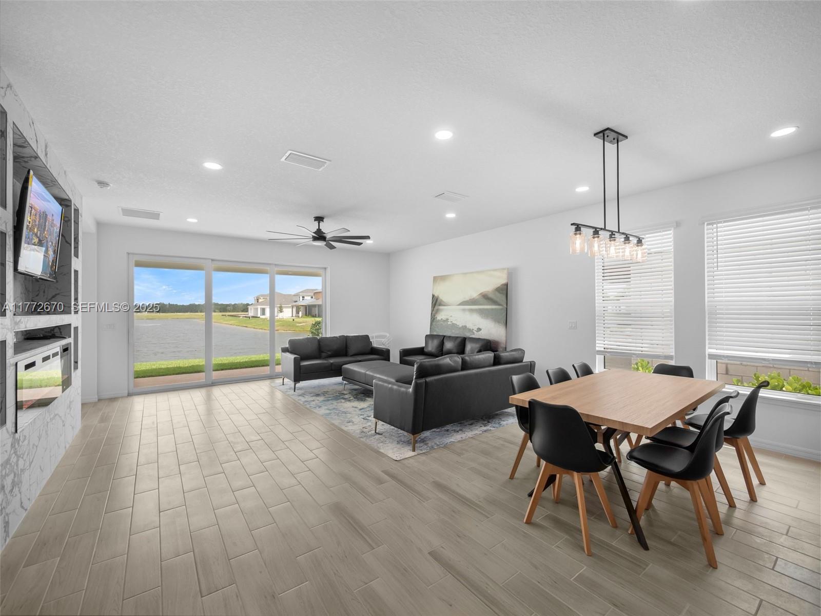 516 Ranch Oak Circle Port St. Lucie, FL 34984 - Photo 26 of 44 a view of a dining room with furniture window and wooden floor