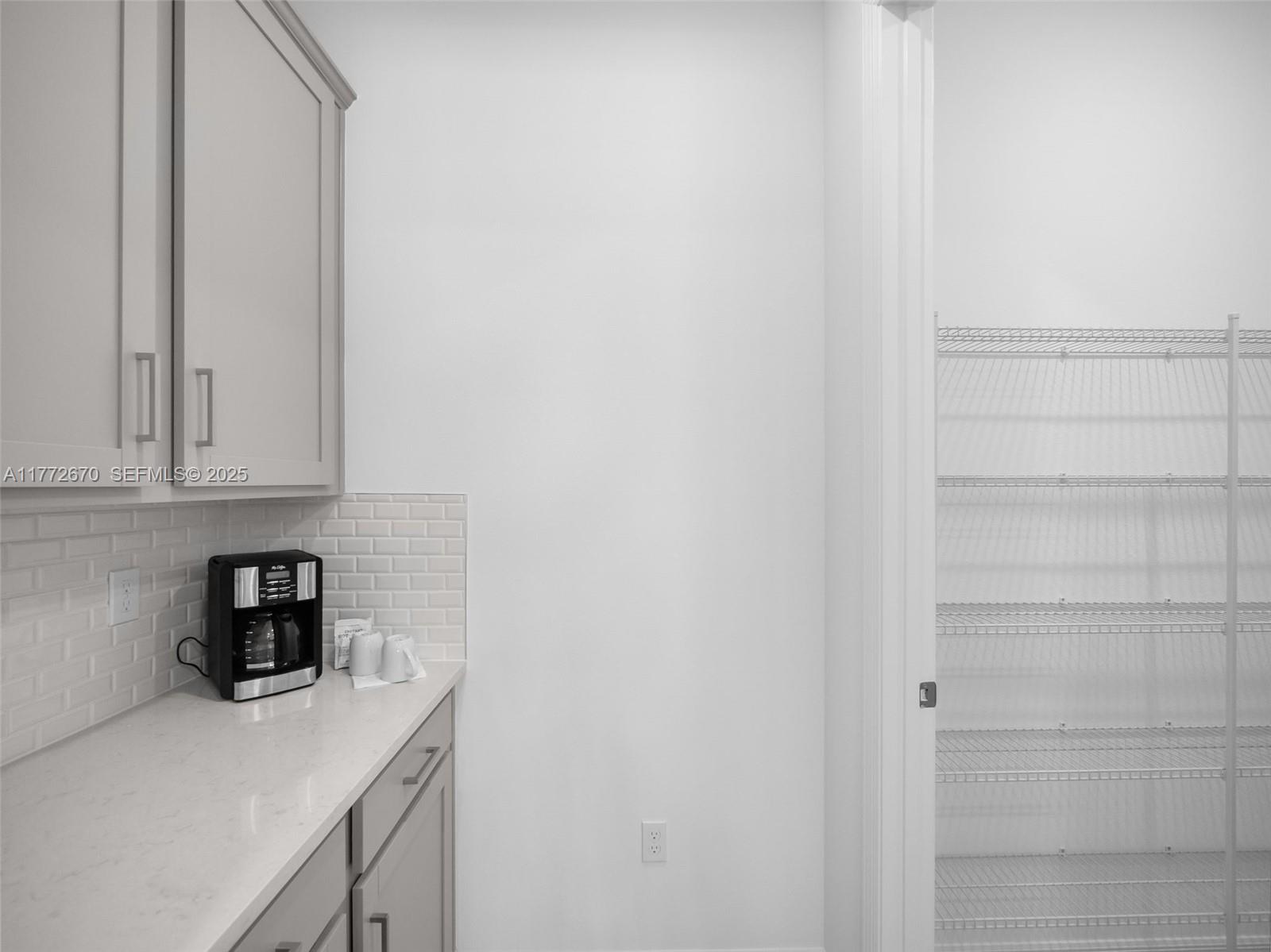 516 Ranch Oak Circle Port St. Lucie, FL 34984 - Photo 32 of 44 a view of storage and utility room with washer and dryer