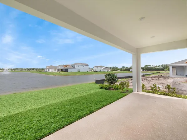a view of a field with an ocean view