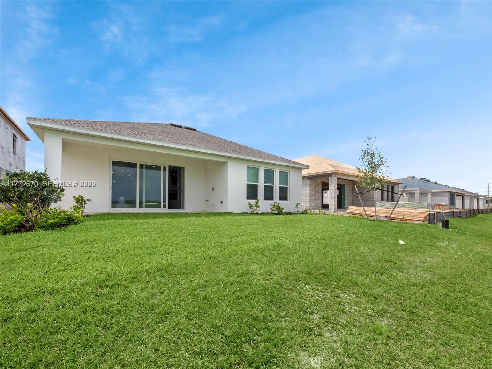 516 Ranch Oak Circle Port St. Lucie, FL 34984 - Photo 40 of 44 a view of a yard in front of a house