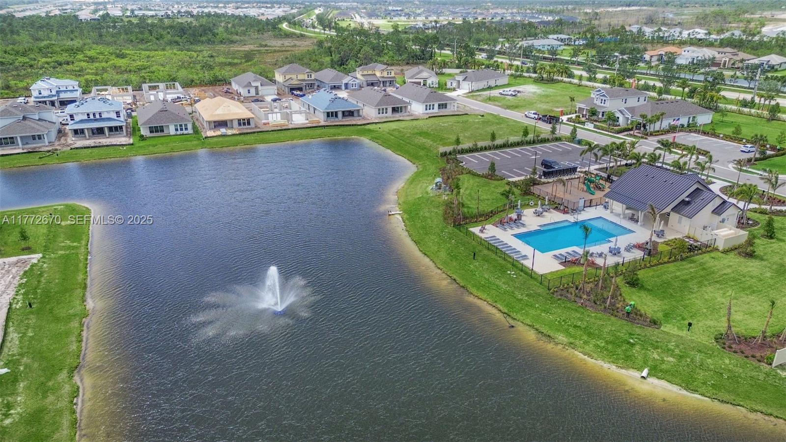 516 Ranch Oak Circle Port St. Lucie, FL 34984 - Photo 42 of 44 an aerial view of a house with a garden and lake view
