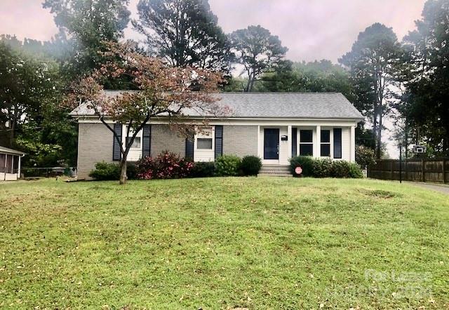 6334 Beecher Drive Charlotte, NC 28215 - Photo 1 of 27 a front view of house with yard and green space