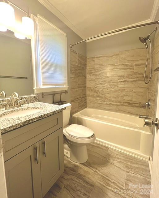 6334 Beecher Drive Charlotte, NC 28215 - Photo 15 of 27 a bathroom with a granite countertop toilet a sink and bathtub