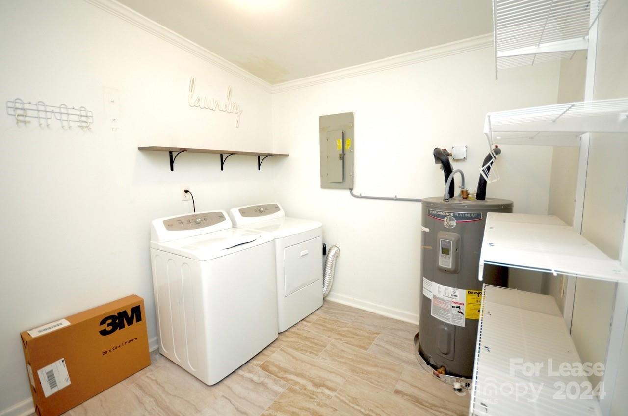 6334 Beecher Drive Charlotte, NC 28215 - Photo 16 of 27 a utility room with dryer and washer
