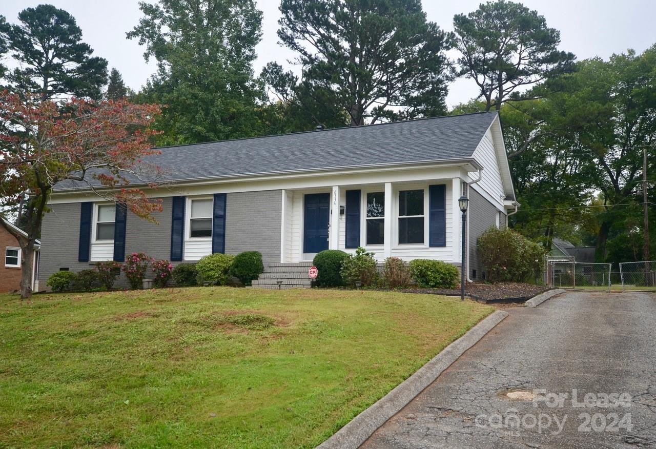 6334 Beecher Drive Charlotte, NC 28215 - Photo 2 of 27 a view of a house with a yard