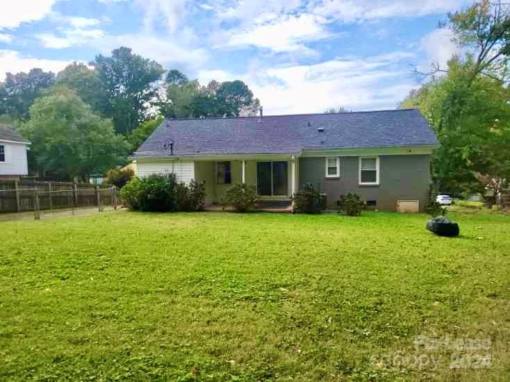 6334 Beecher Drive Charlotte, NC 28215 - Photo 24 of 27 a front view of a house with a garden