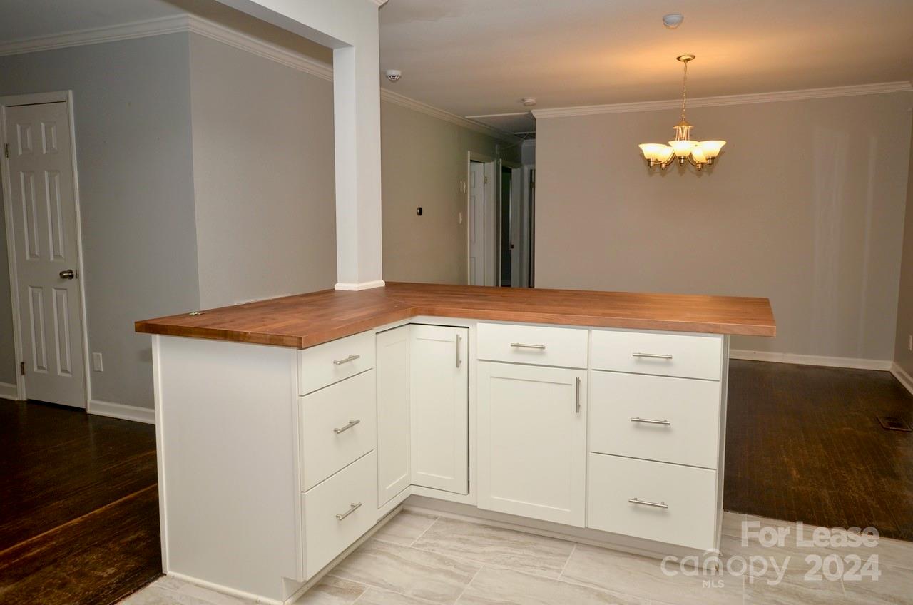 6334 Beecher Drive Charlotte, NC 28215 - Photo 8 of 27 a bathroom with a sink and vanity