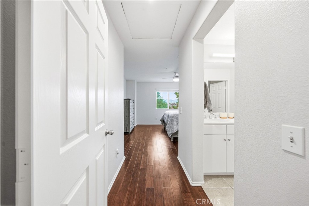 33656 Winston Way, Unit A Temecula, CA 92592 - Photo 19 of 46 a view of a hallway with wooden floor and furniture