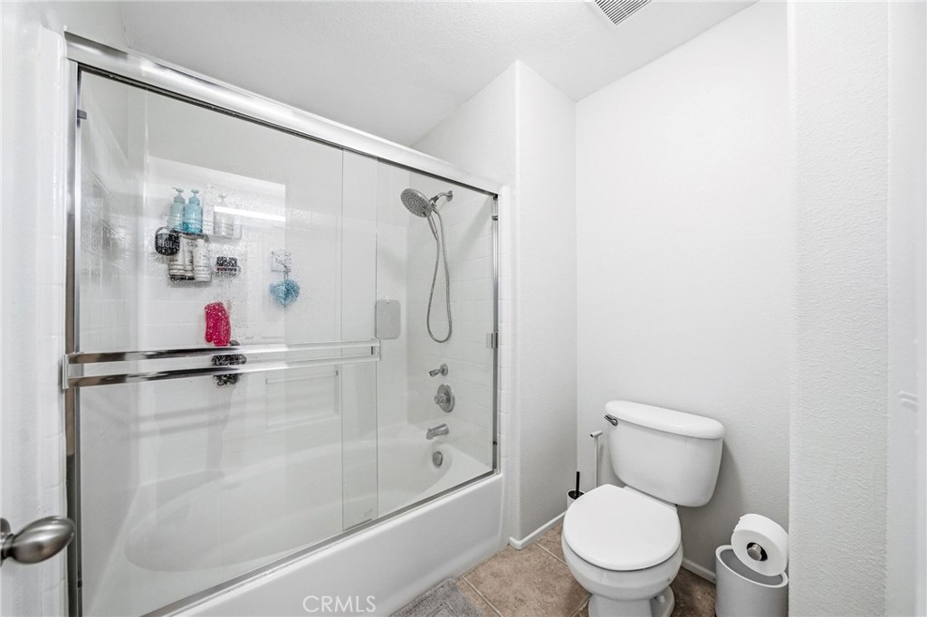 33656 Winston Way, Unit A Temecula, CA 92592 - Photo 24 of 46 a white toilet sitting next to a bathroom sink