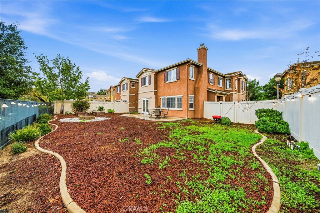 33656 Winston Way, Unit A Temecula, CA 92592 - Photo 35 of 46 a front view of a house with yard and green space