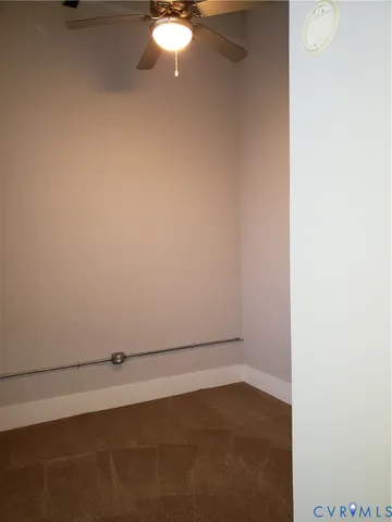 a view of a closet area with staircase