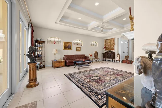 a living room with furniture rug and a table