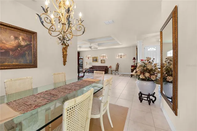 a living room with furniture and a mirror