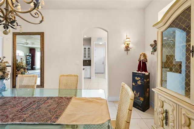 a bedroom with a bed lamps and a window