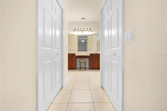 a bathroom with a sink a toilet a mirror and shower