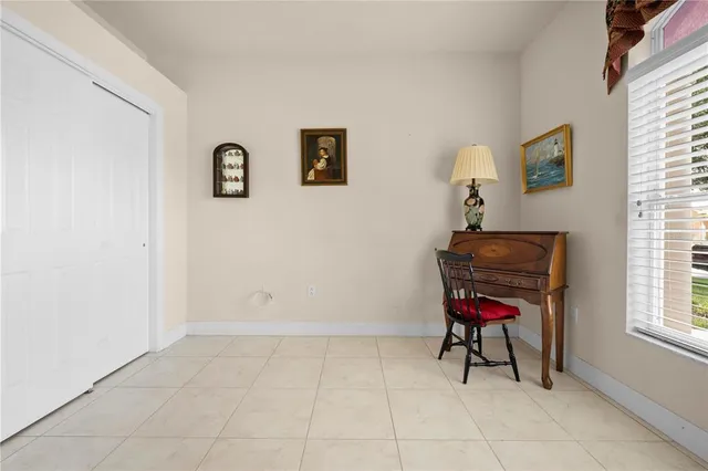 an empty room with windows and closet