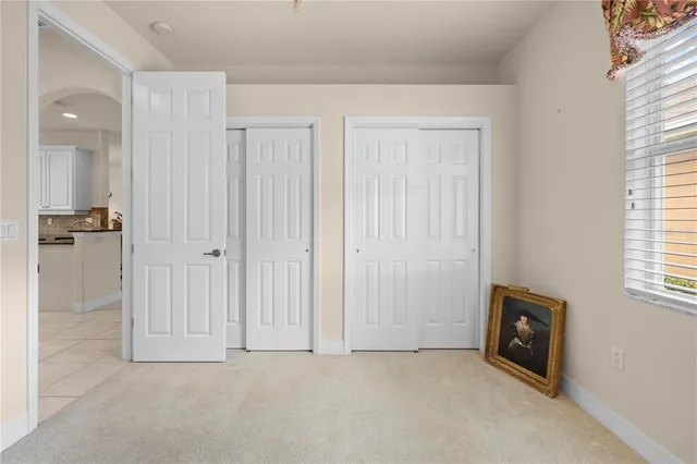 a utility room with cabinets washer and dryer
