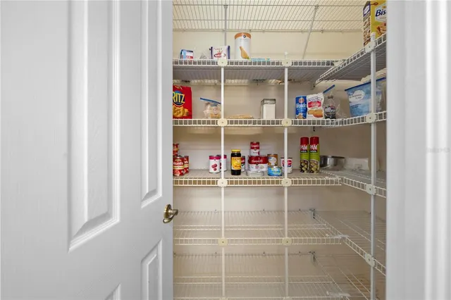 an aerial view of a house with a big yard and large trees