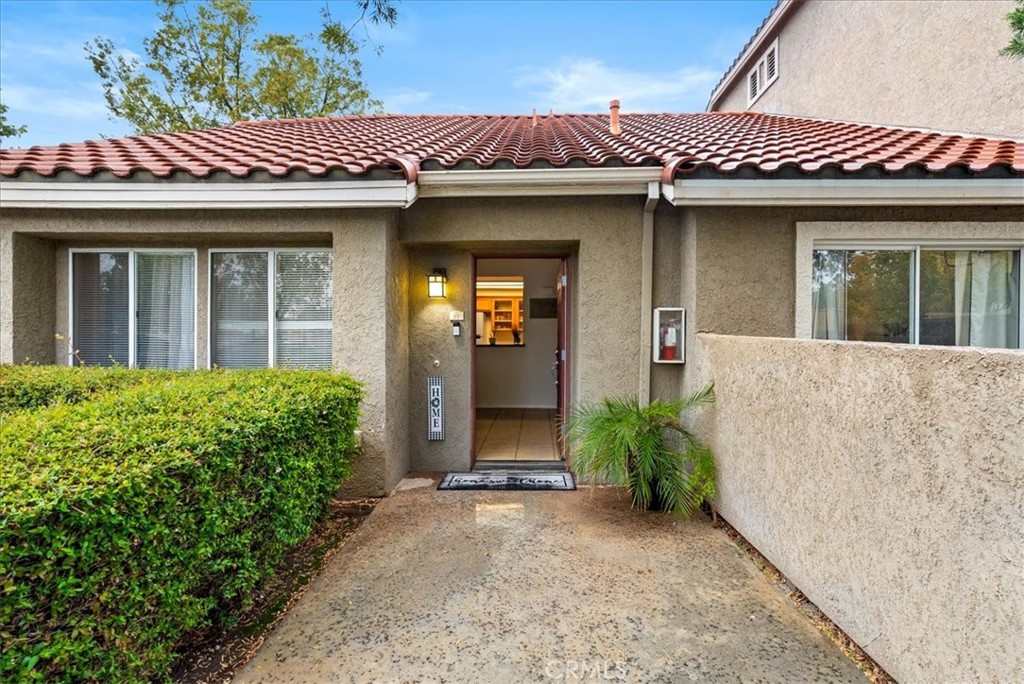 200 East Alessandro Boulevard, Unit 17 Riverside, CA 92508 - Photo 1 of 1 a view of a house with potted plants