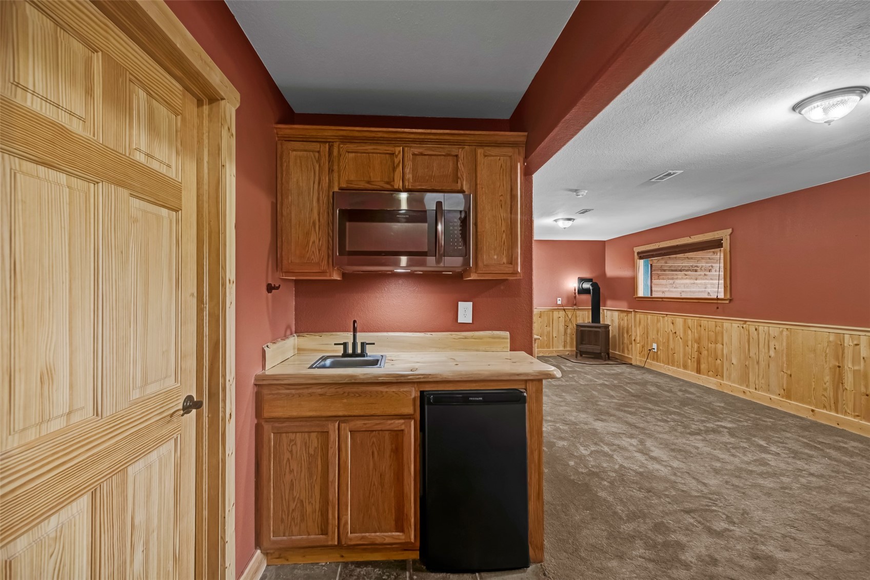 2491 Stagestop Road Jefferson, CO 80456 - Photo 23 of 43 a kitchen with stainless steel appliances granite countertop a stove a sink and a microwave