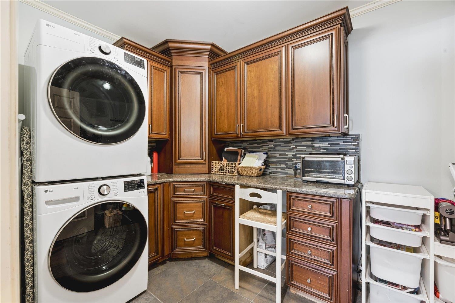 5311 South Angela Road Memphis, TN 38120 - Photo 17 of 40 a view of a storage and utility room with washer and dryer