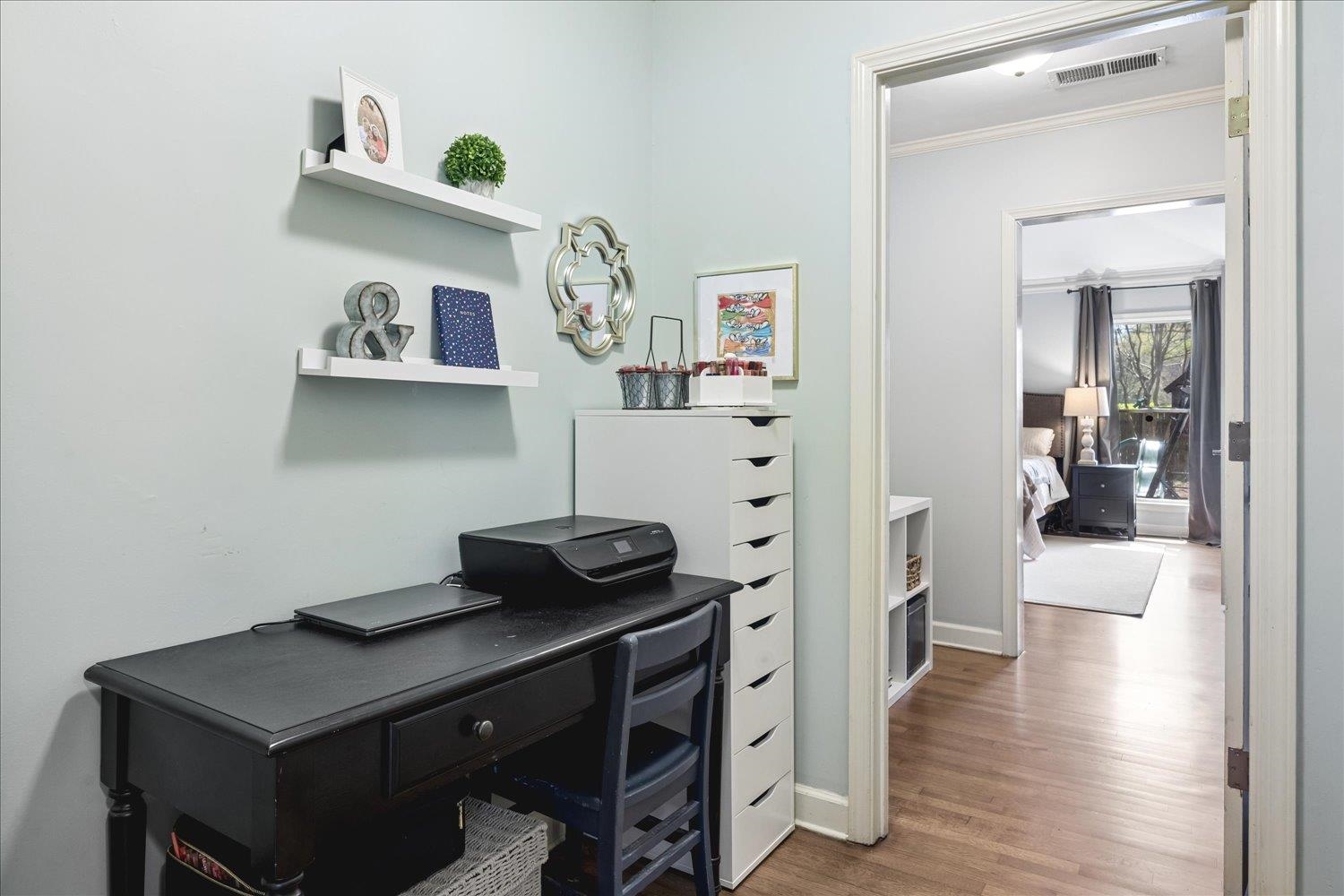 5311 South Angela Road Memphis, TN 38120 - Photo 20 of 40 a kitchen with a cabinets and wooden floor