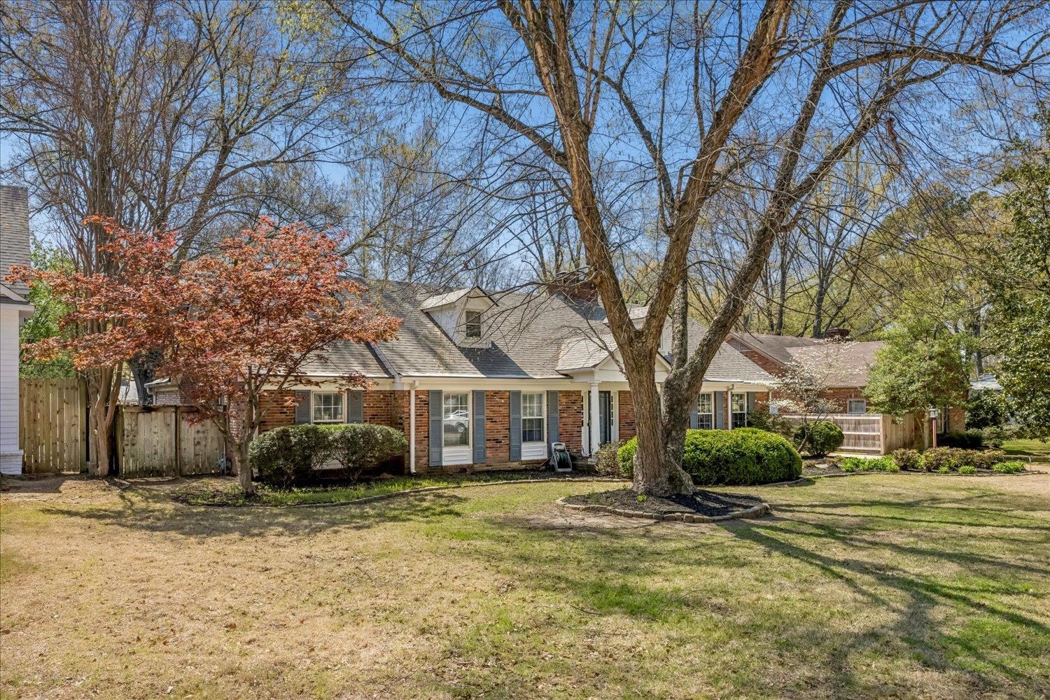 5311 South Angela Road Memphis, TN 38120 - Photo 2 of 40 a front view of a house with a yard