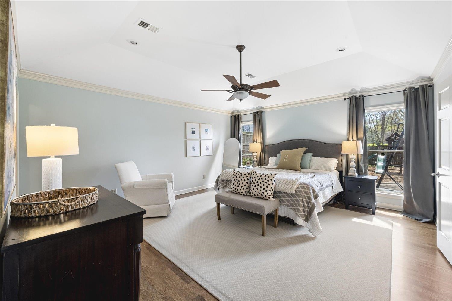 5311 South Angela Road Memphis, TN 38120 - Photo 21 of 40 a bedroom with a bed and a chandelier