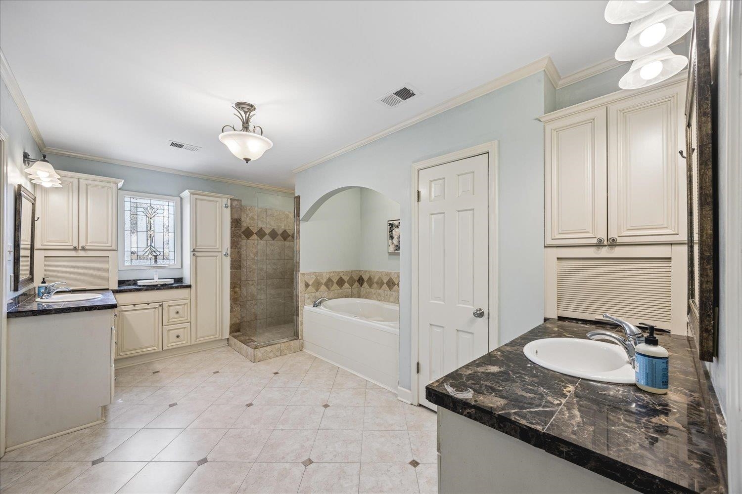 5311 South Angela Road Memphis, TN 38120 - Photo 25 of 40 a large white kitchen with a stove a sink dishwasher and a refrigerator with wooden floor