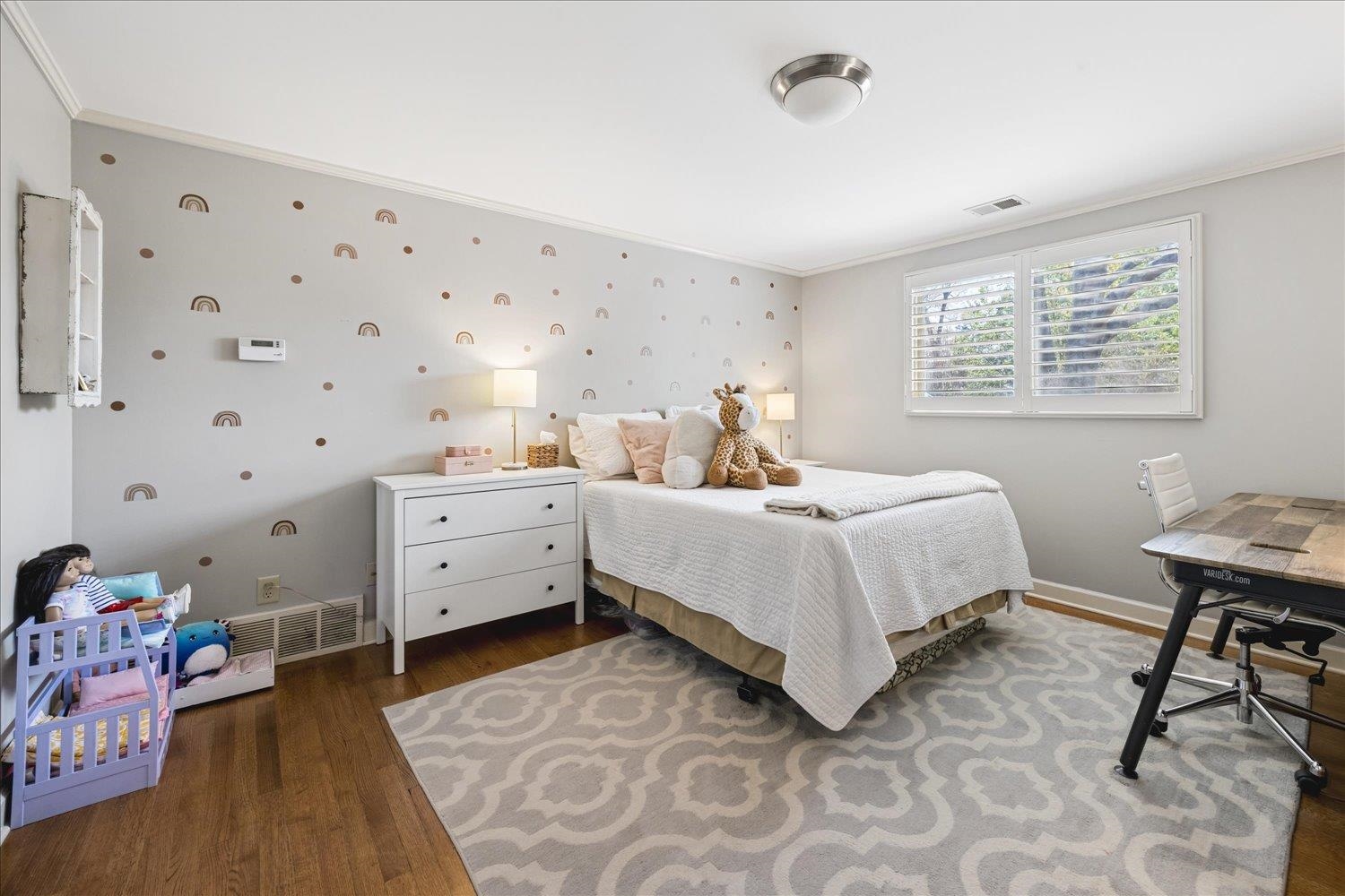 5311 South Angela Road Memphis, TN 38120 - Photo 31 of 40 a bed room with a bed and a chair