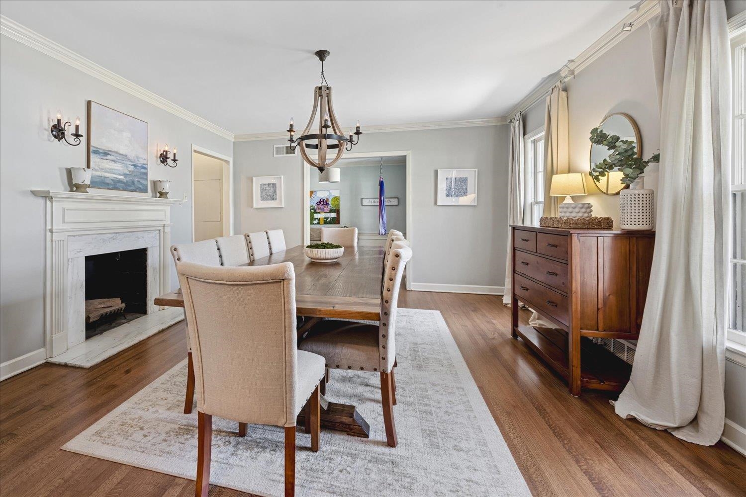5311 South Angela Road Memphis, TN 38120 - Photo 8 of 40 a view of a dining room with furniture window and wooden floor