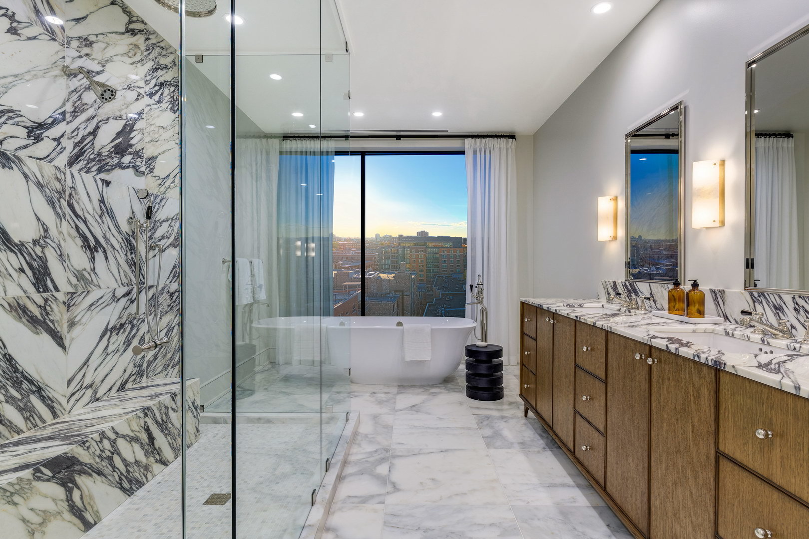 21 North May Street, Unit 1301 Chicago, IL 60607 - Photo 19 of 25 a bathroom with a double vanity sink toilet and shower
