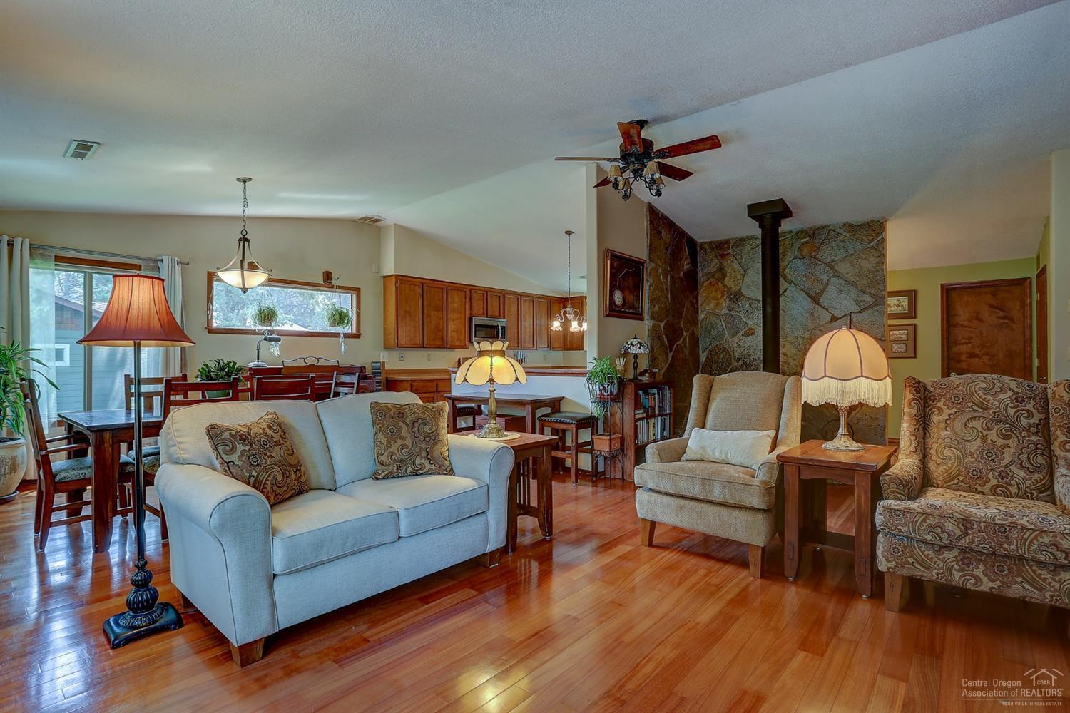20358 Donkey Sled Road Bend, OR 97702 - Photo 8 of 17 a living room with furniture and wooden floor