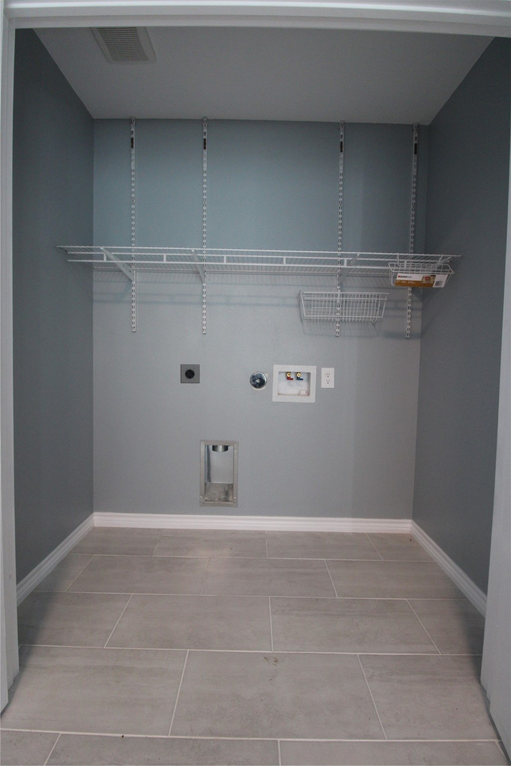 503 Austin Street Brazoria, TX 77422 - Photo 11 of 24 a view of storage and utility room with racks on the wall