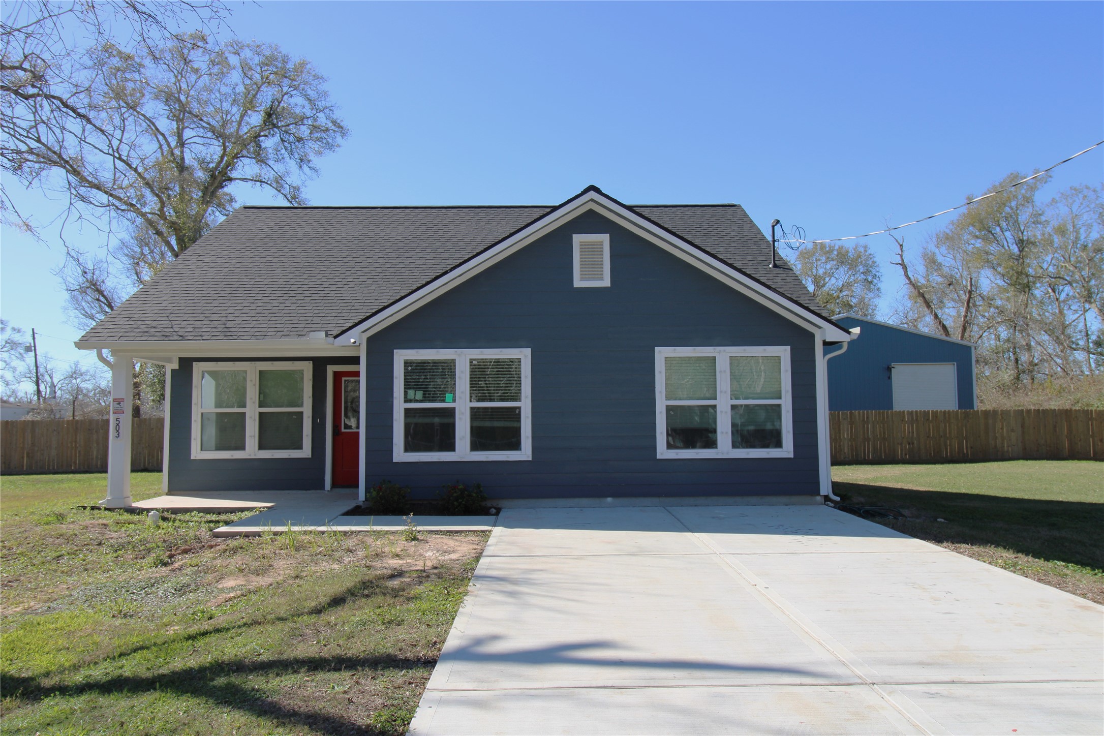 503 Austin Street Brazoria, TX 77422 - Photo 2 of 24 a front view of a house with a garden