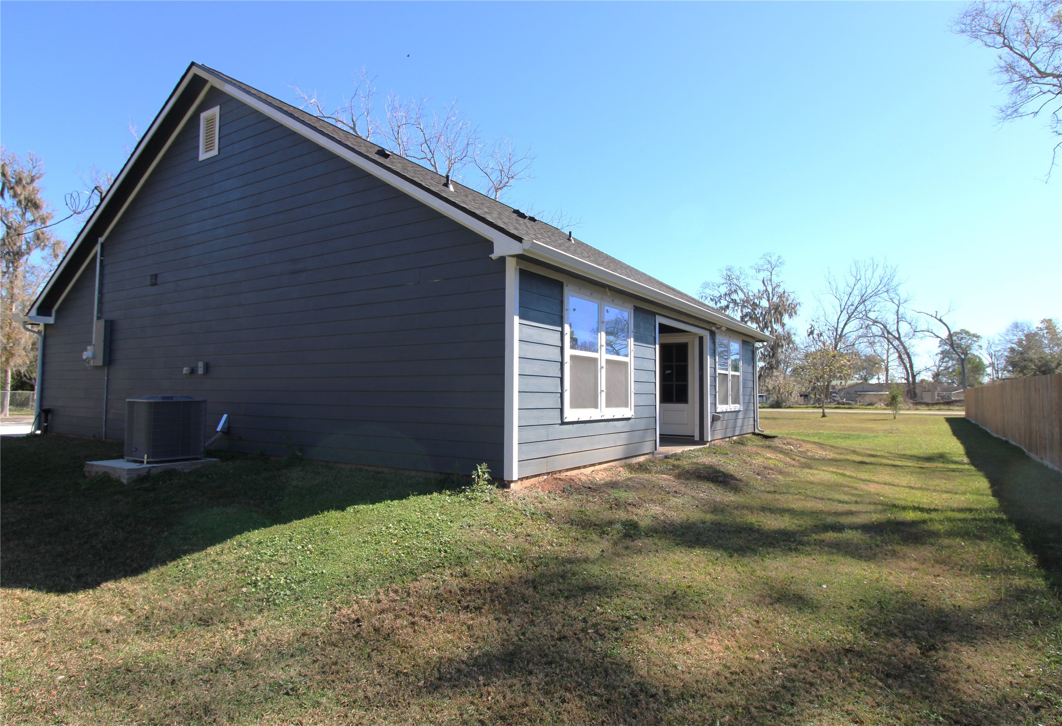503 Austin Street Brazoria, TX 77422 - Photo 4 of 24 a view of a house with backyard and trees