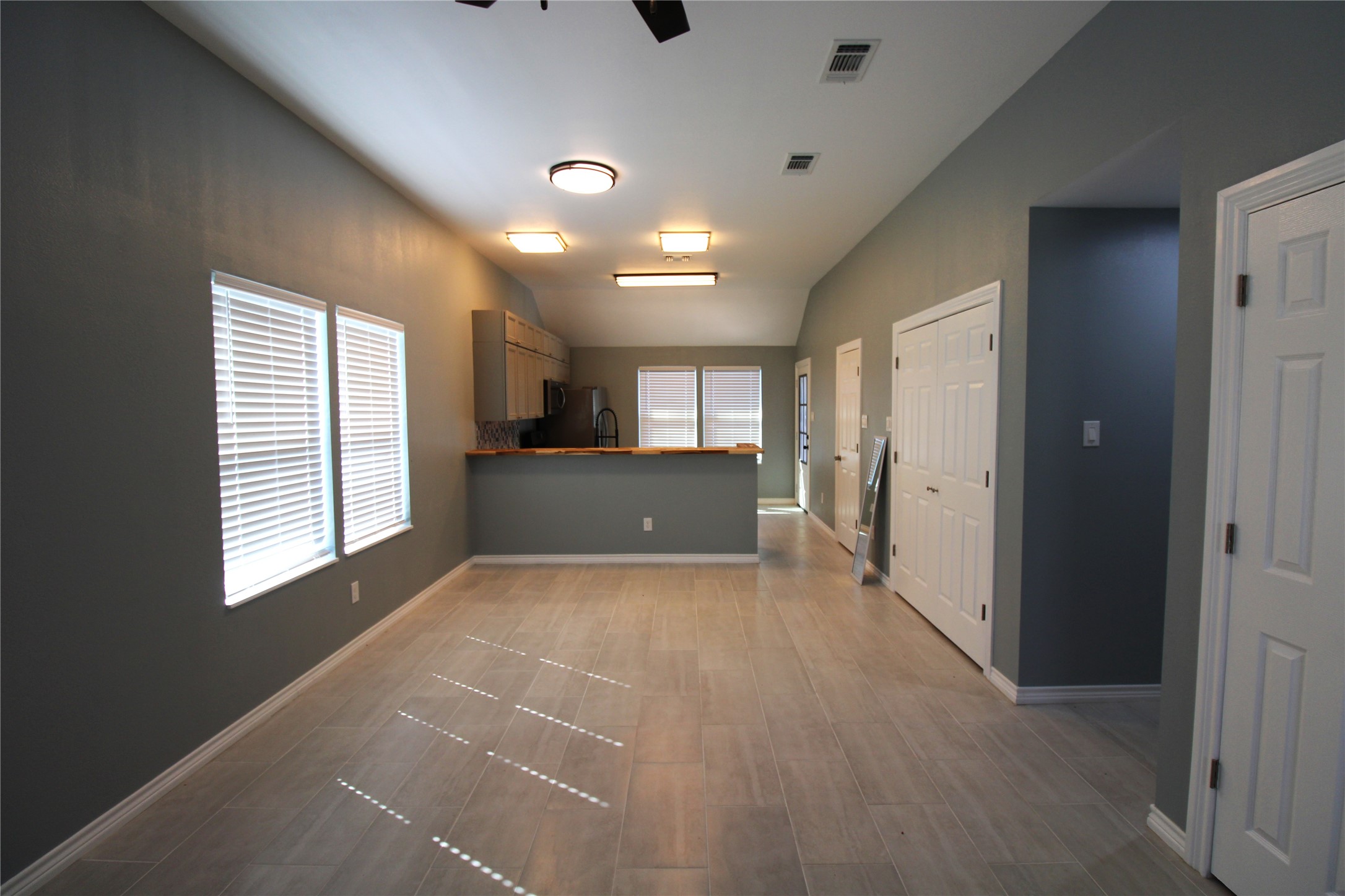 503 Austin Street Brazoria, TX 77422 - Photo 5 of 24 a view of kitchen and windows