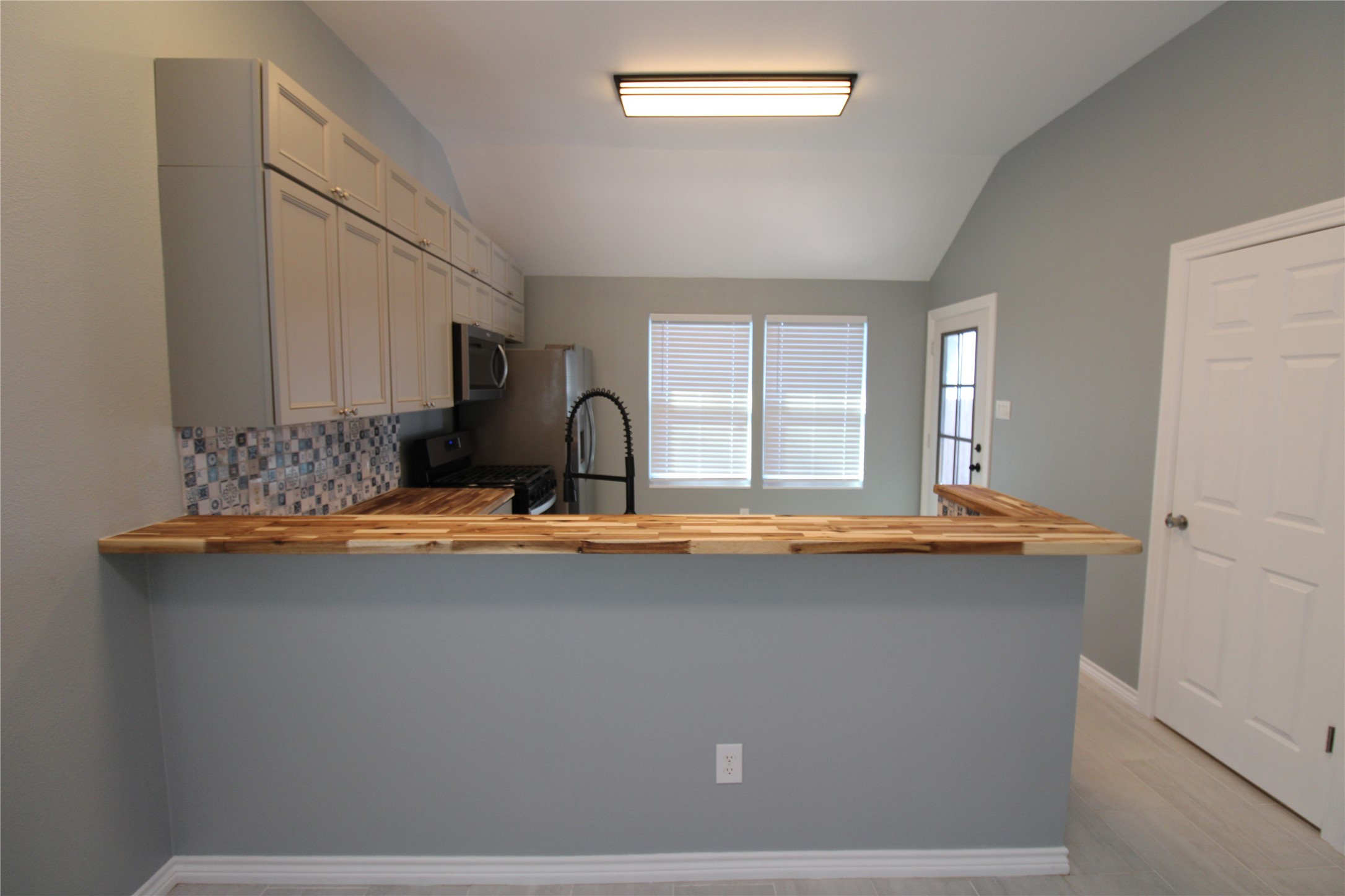503 Austin Street Brazoria, TX 77422 - Photo 9 of 24 a room with a sink and a refrigerator